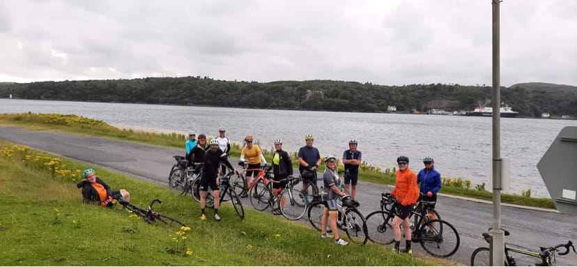 An image of cyclists taking a break.